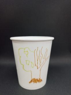A white cup with a drawing on it

Description automatically generated with medium confidence
