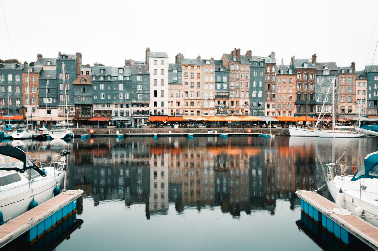 Charming streets of Honfleur, adorned with colorful and timber-framed houses.