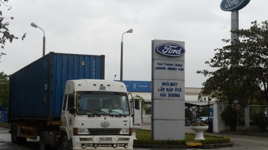 This picture taken on January 11, 2017 shows a truck leaving the main gate of the Ford automotive plant in the northern province of Hai Duong.