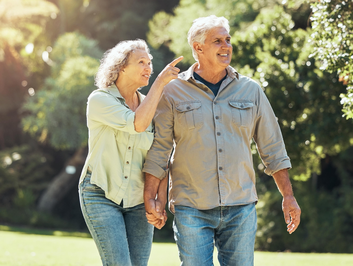 senior couple walking and holding hands