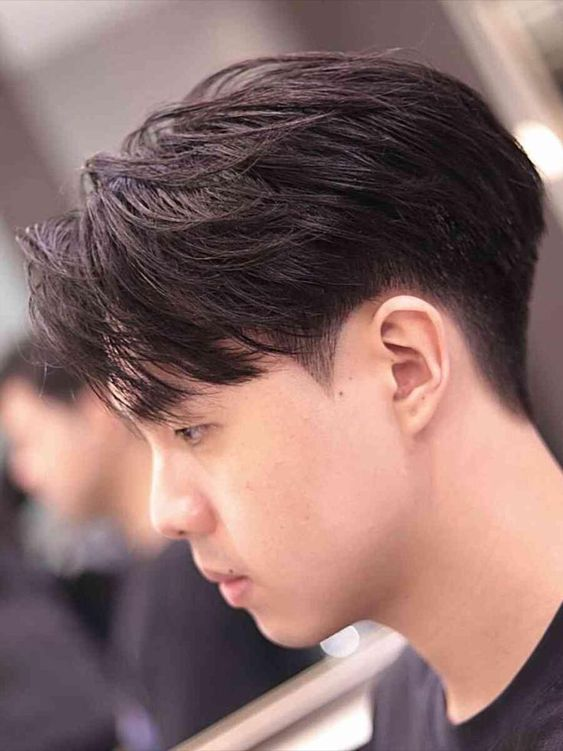 Side view of a guy rocking one of the popular korean haircut