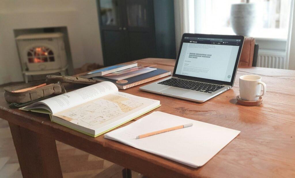 study desk with notebook and subject book - How To Study For A Test Effectively