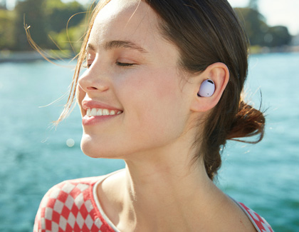 Woman smiling while wearing Galaxy Buds2 Pro