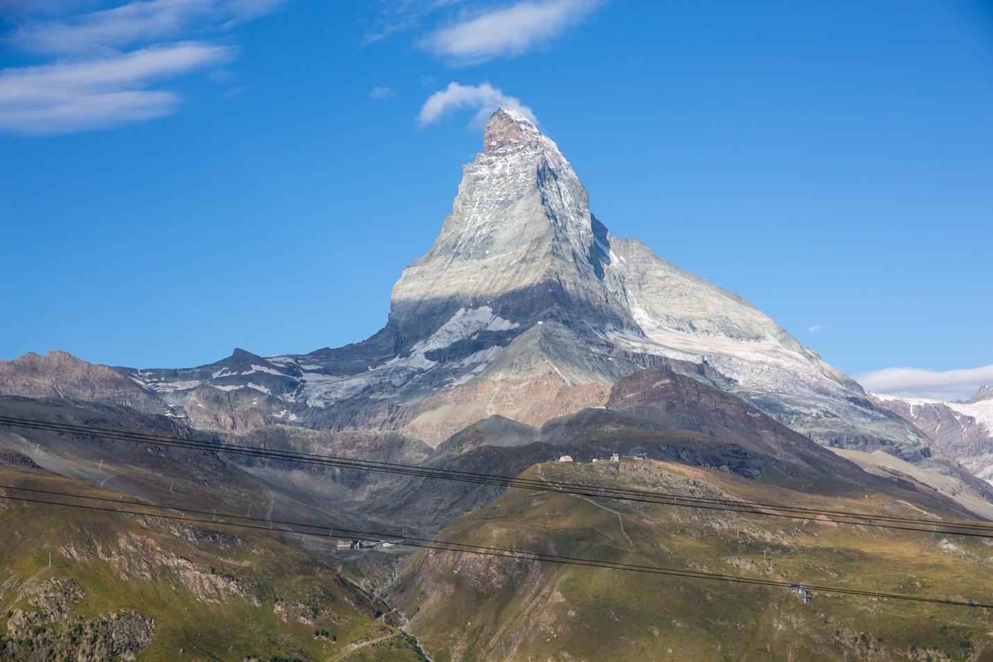 Matterhorn with a cloud in the sky

Description automatically generated