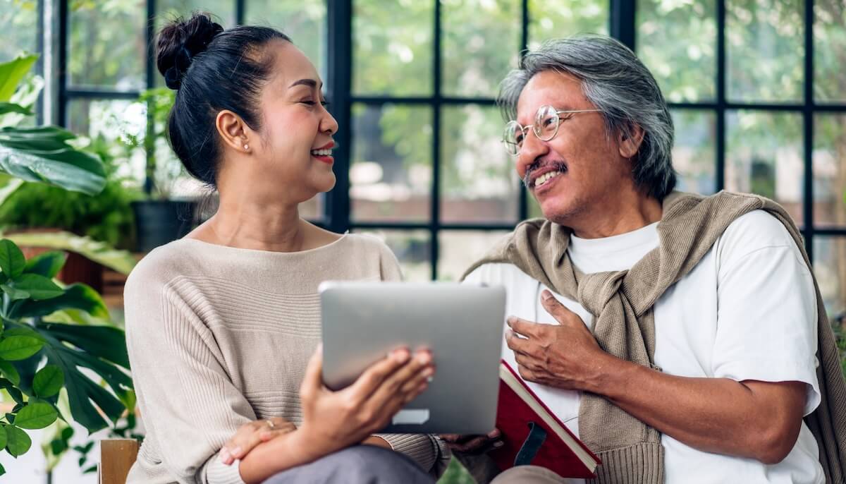 What are important differences between telehealth and in-person care: senior couple using a tablet