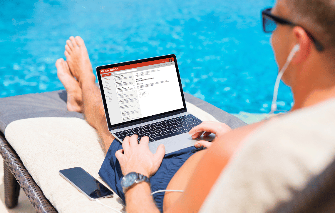 Man viewing email by the pool