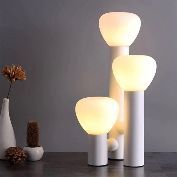 Table lamp with three bulbs and white handle 