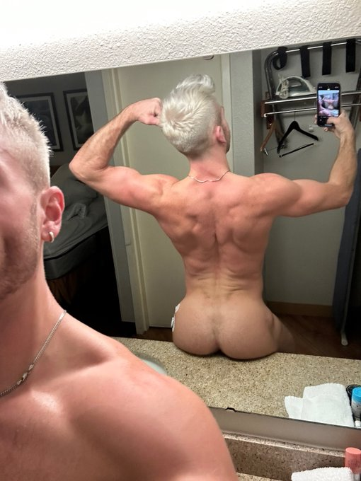 gay male bottle blonde poses naked in bathroom for iphone mirror selfie with ass his hairy ass cheeks sitting on the bathroom sink