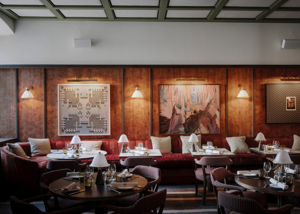 Restaurant area in soho house stockholm using discreet audio system for customer experience.