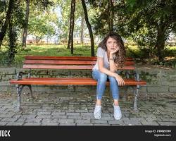 person feeling depressed sitting on a park bench