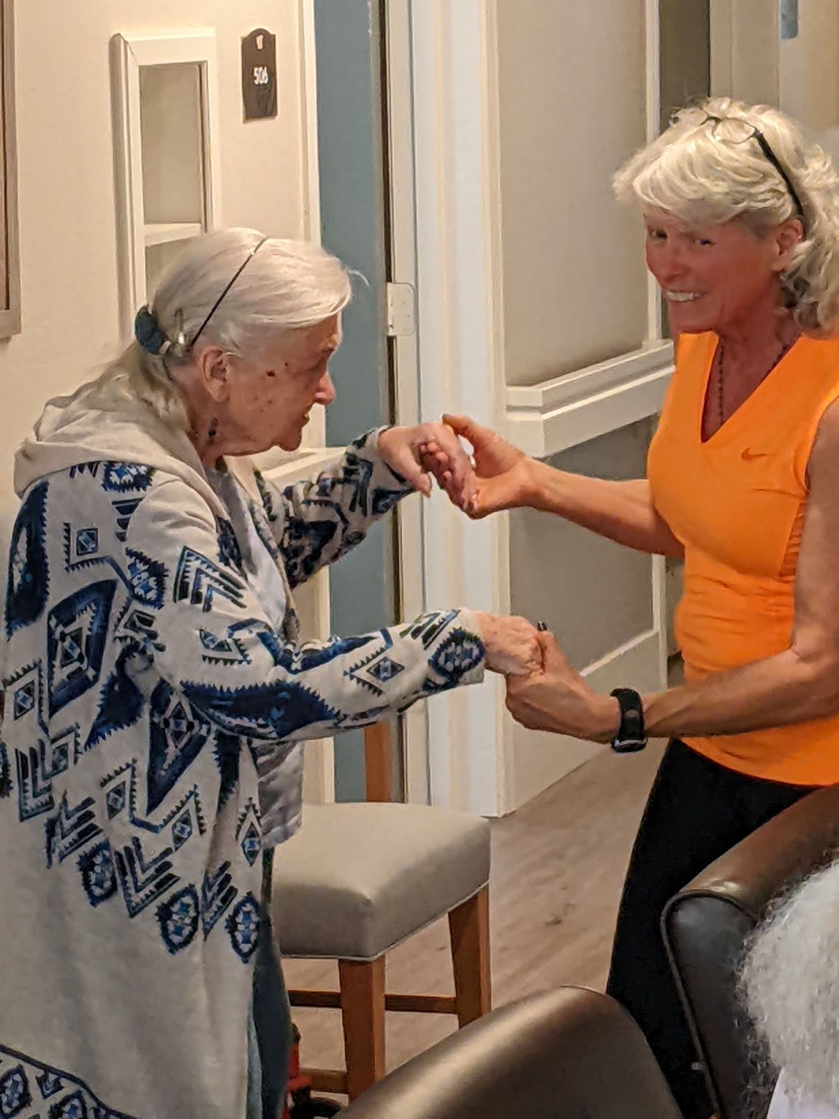 a volunteer dances with a resident at pacifica senior living Peoria