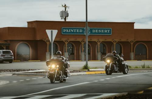 Free Two Men Riding on Touring Motorcycle Near Painted Desert Store Stock Photo