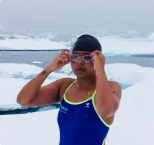 A person in a swimsuit and goggles

Description automatically generated