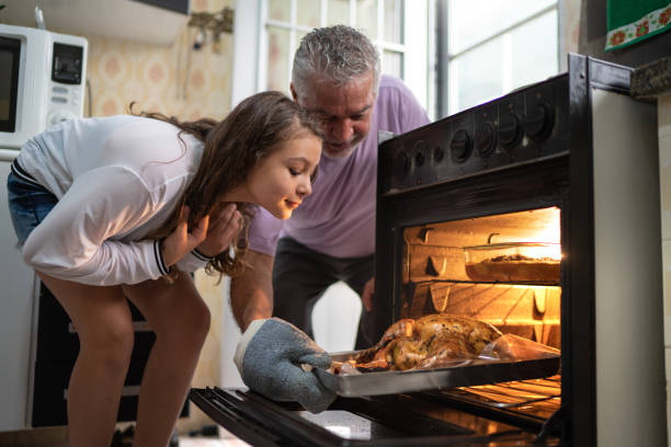 Child and Grand Father checking Turkey