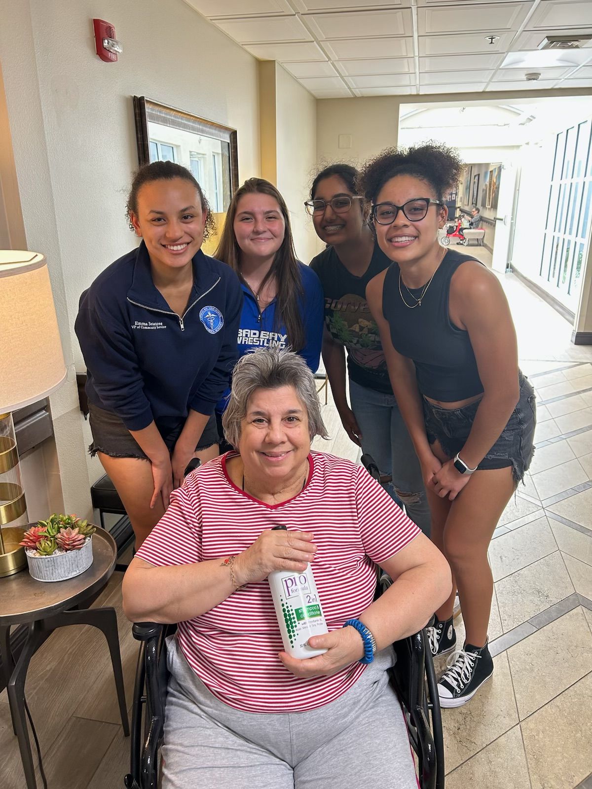 highschool students visit with Pacifica senior living sunrise resident
