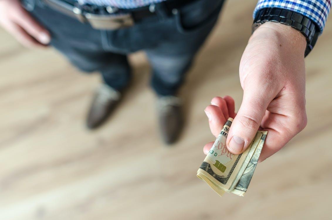 Free Person Holding Banknote Stock Photo