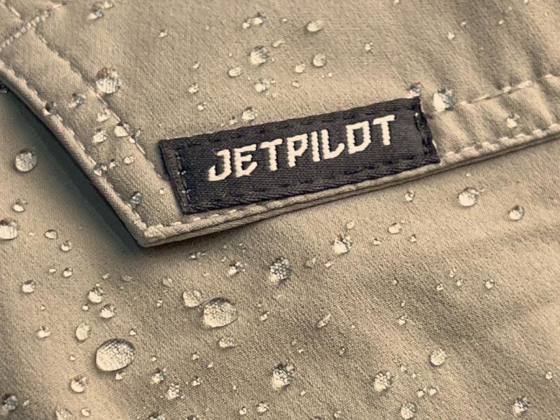 A close-up of a label on a jacket

Description automatically generated