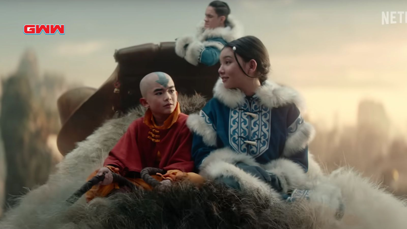 Aang, sokka, and katara riding appa