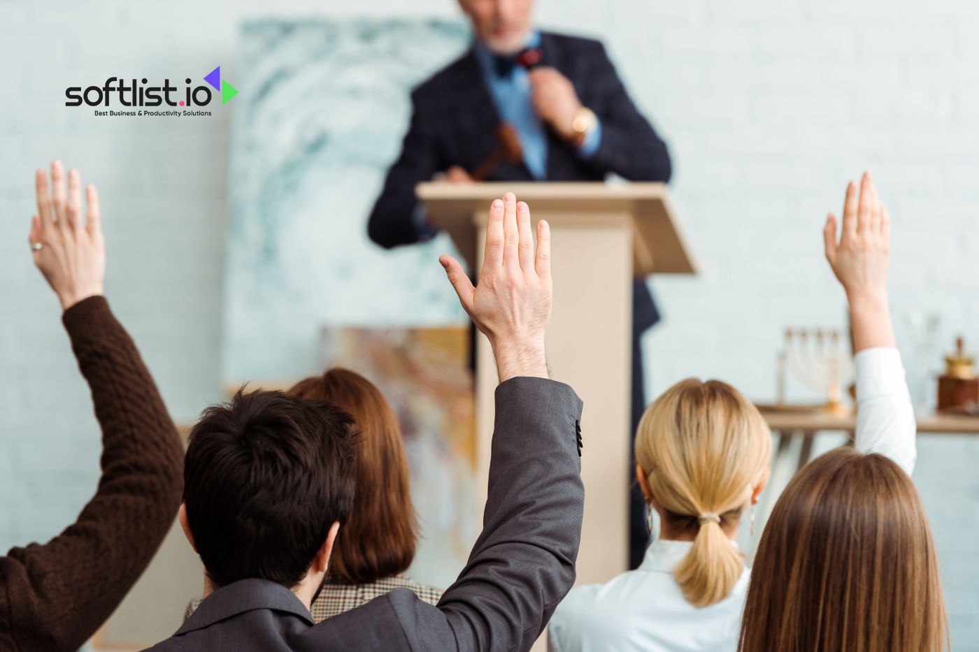 People raising hands at auction