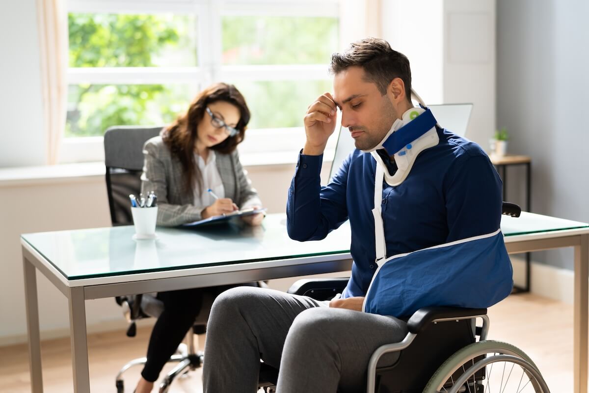Employers liability insurance vs workers compensation: injured employee sitting in a wheelchair