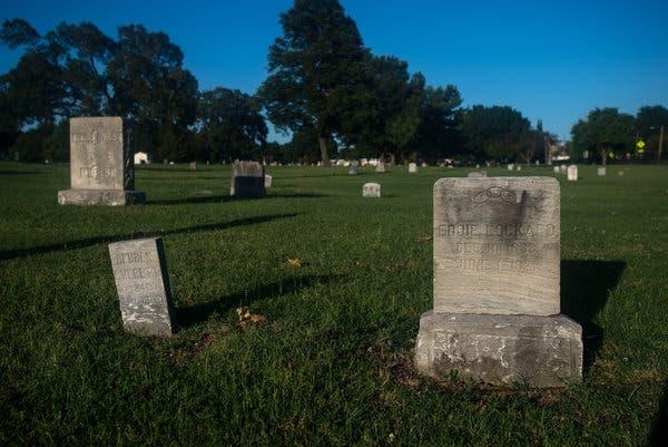 Two of the only known headstones in Oaklawn Cemetery for victims of the race massacre in Tulsa, Okla., in 1921.