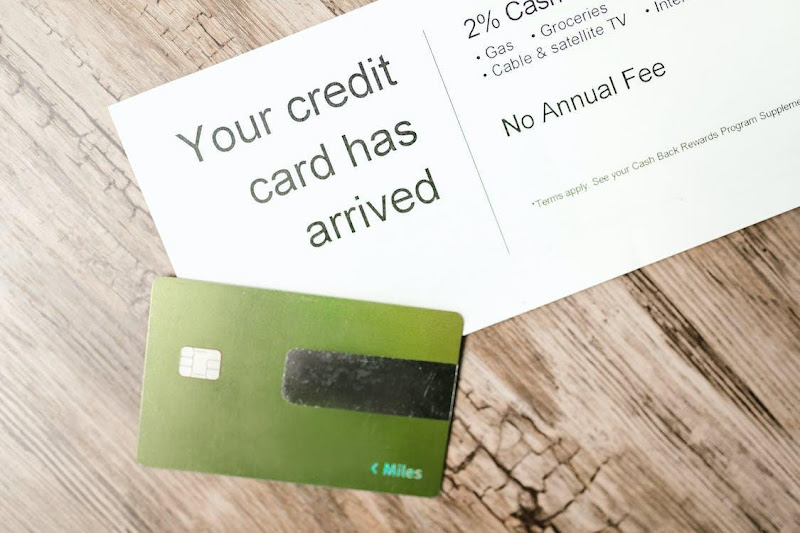 Free Green Card beside a Document Stock Photo