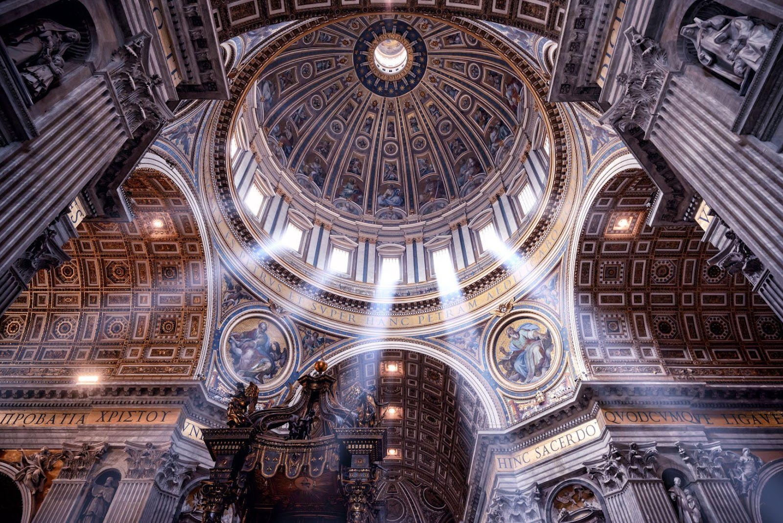 A ceiling with light shining through the ceiling with St. Peter's Basilica in the background

Description automatically generated with medium confidence