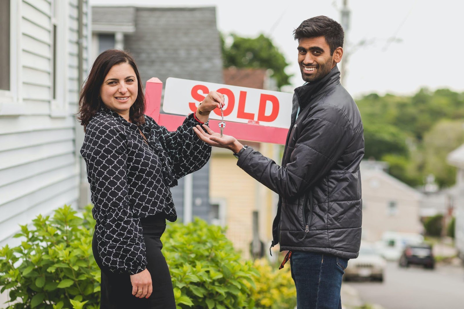 a real estate agent with a home buyer