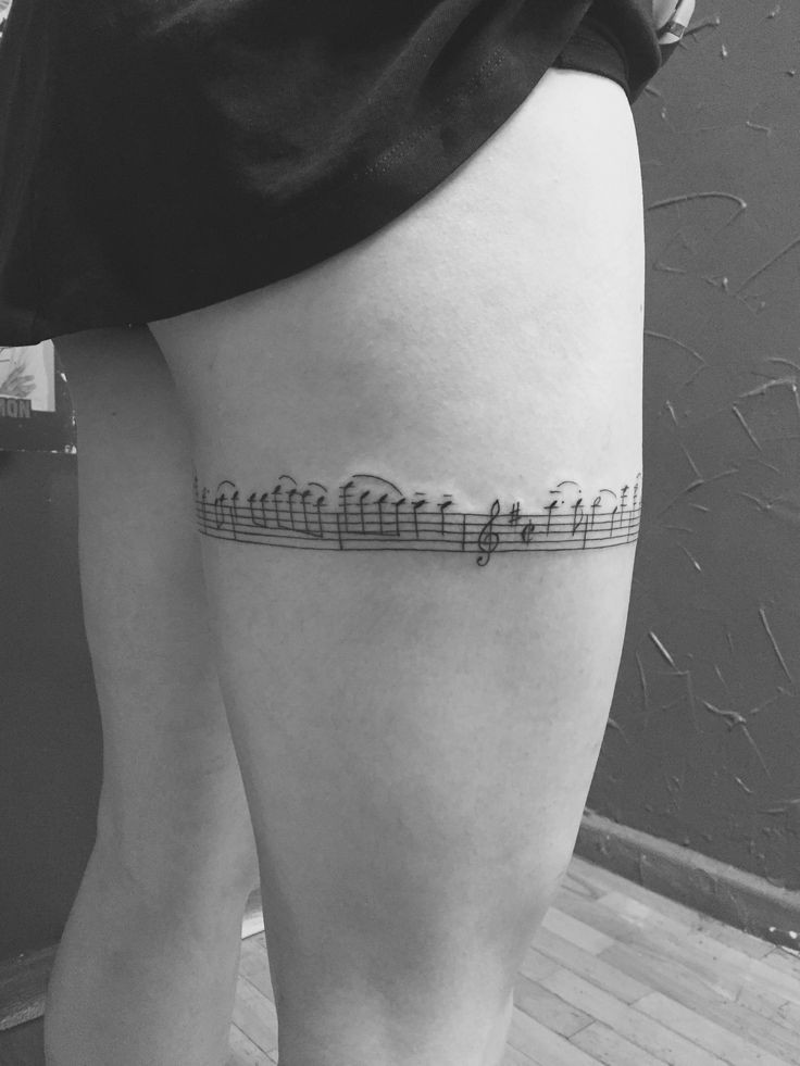 Musical  Note Wrap Around Thigh Tattoo 