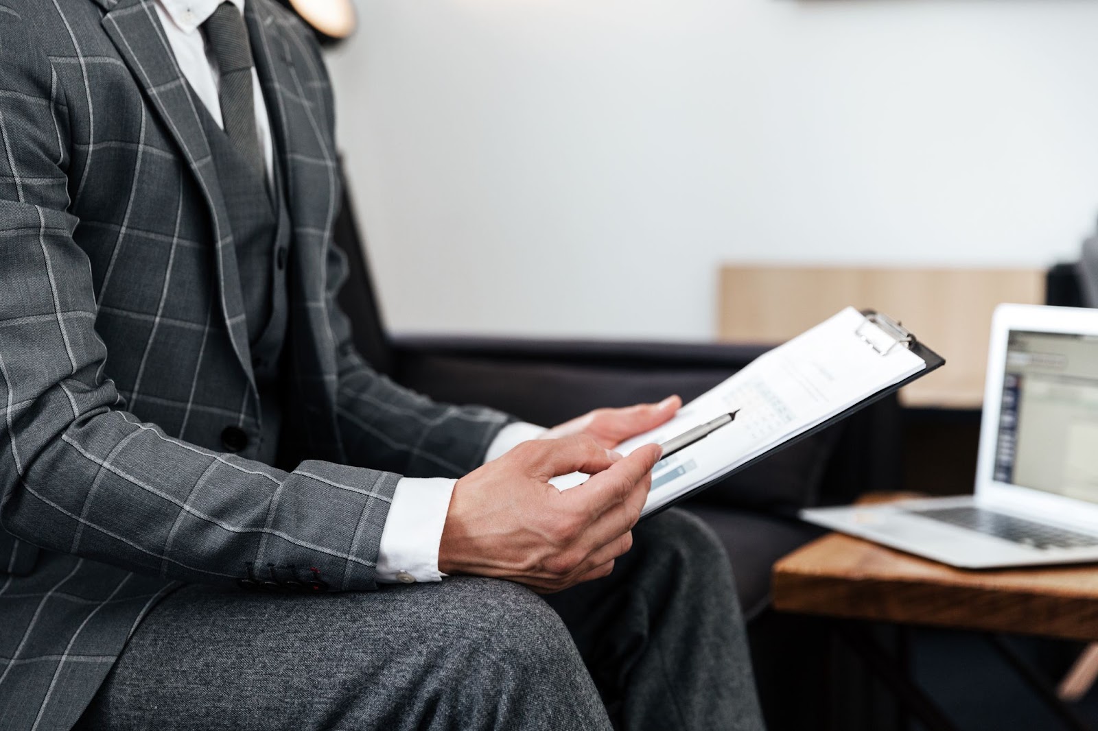 Tax attorney holding pen and document
