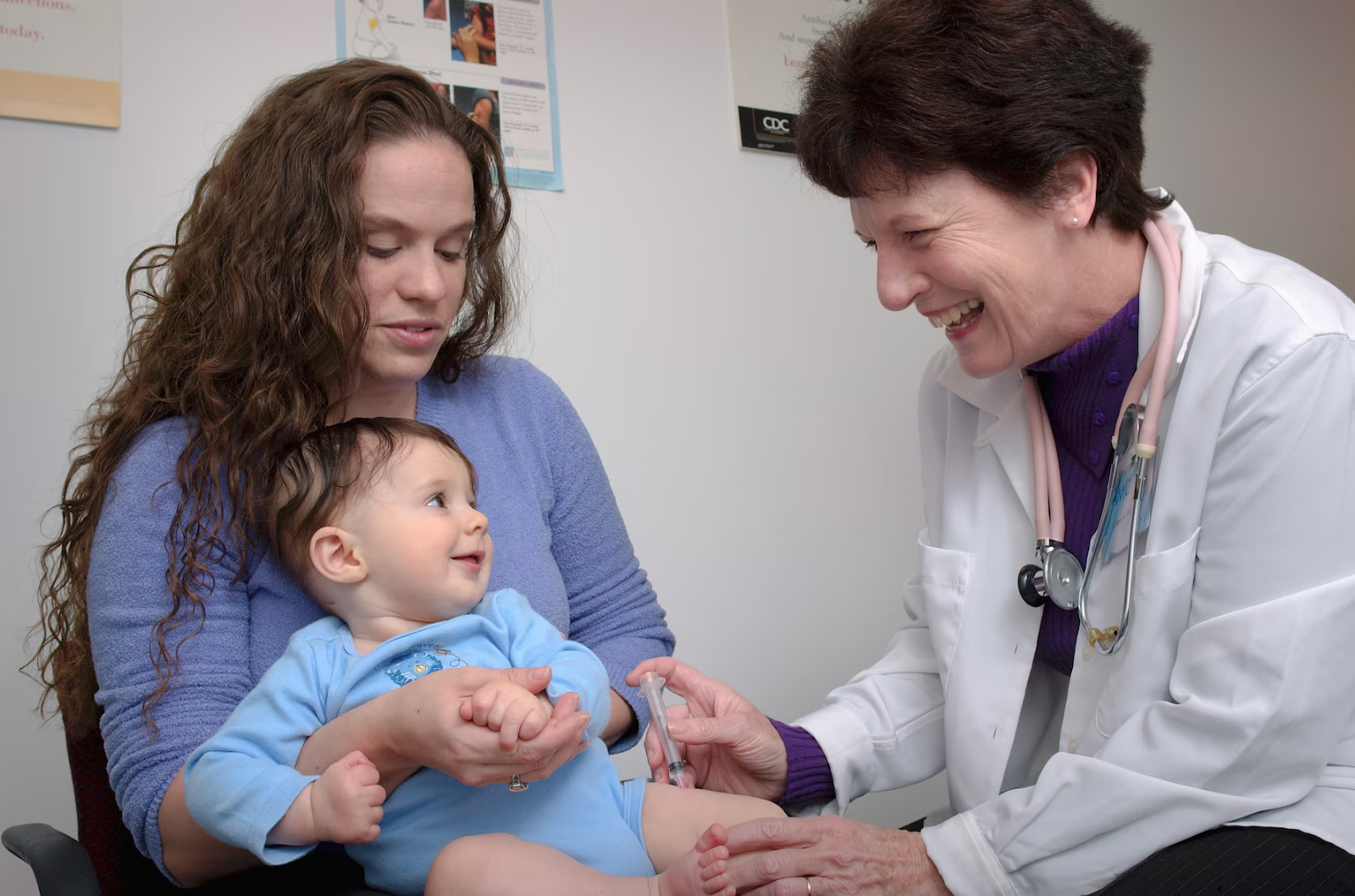 doctor giving baby vaccine