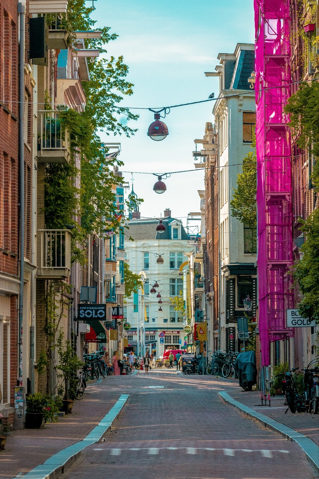 Cobblestone stone streets, cozy cafes, and quirky boutiques add character to Amsterdam neighborhoods.