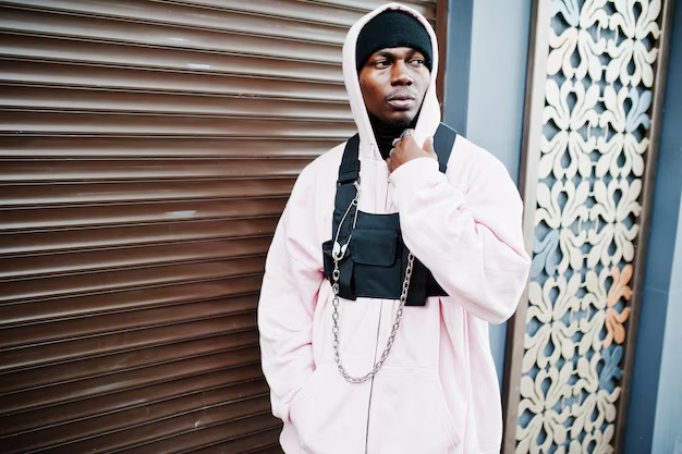 Stylish Man Posing in Light Pink Hoodie