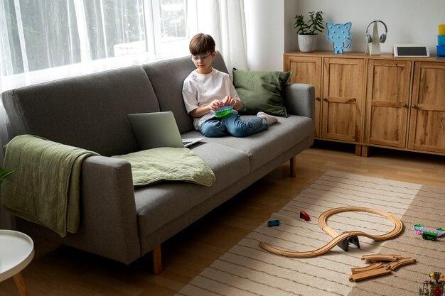 Little boy watching films on the laptop