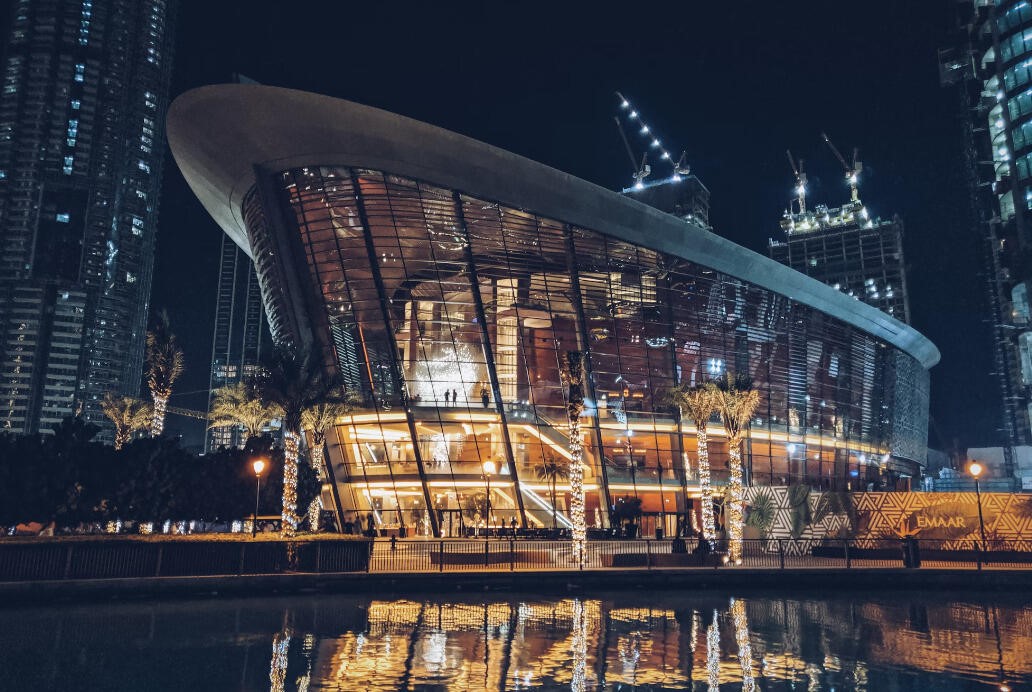 Dubai Opera at night reflected in the lake