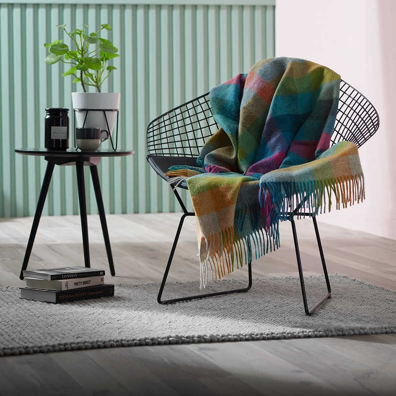 Woolroom blue check throw on a metal chair