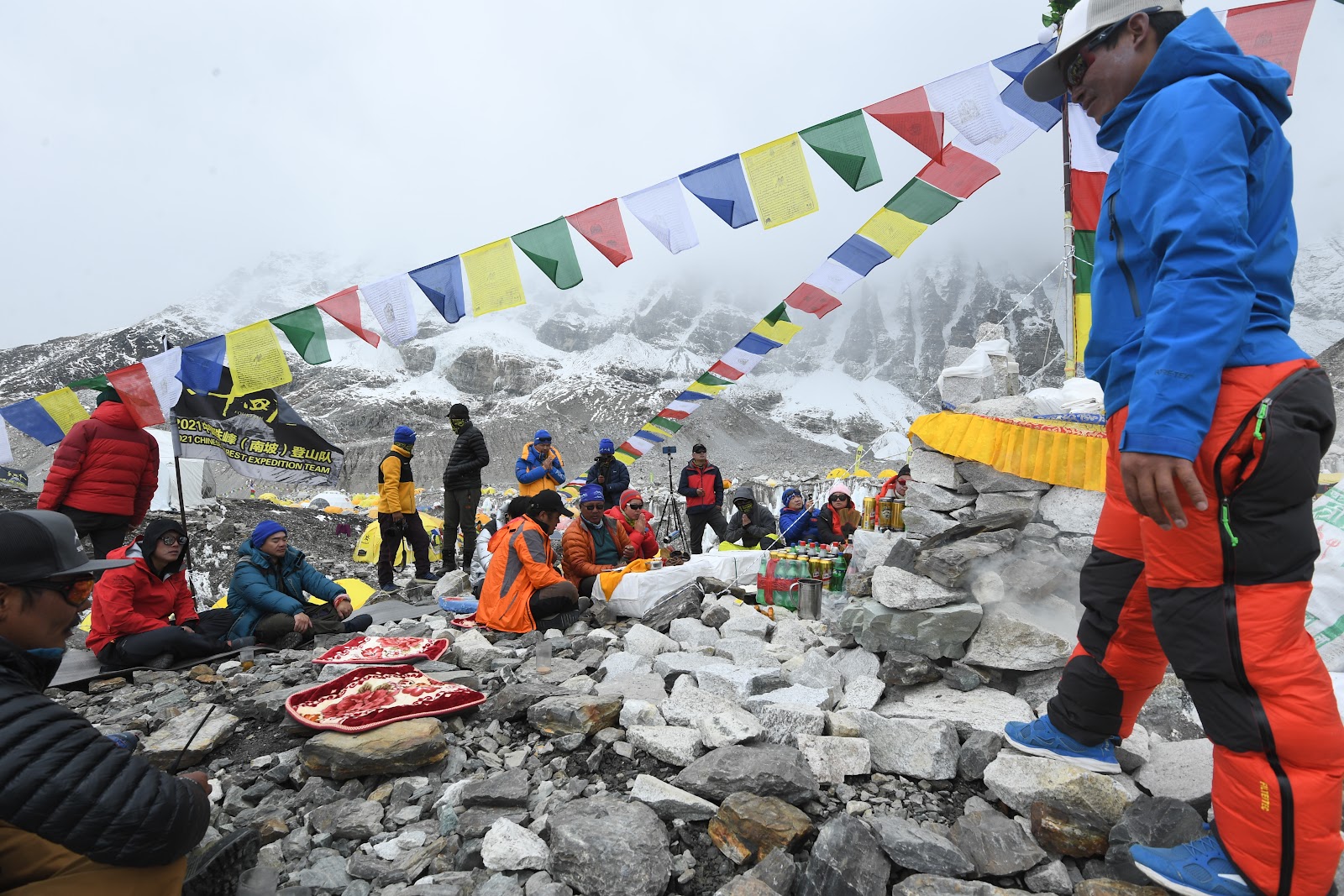Ceremonial prayers at Everest Base Camp, with synthetic prayer flags flying. | Prakash Mathema