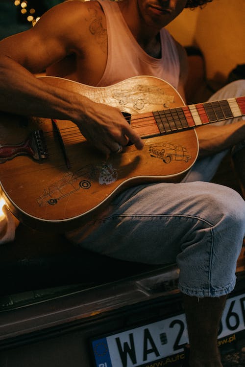 Free A Man Playing an Acoustic Guitar Stock Photo