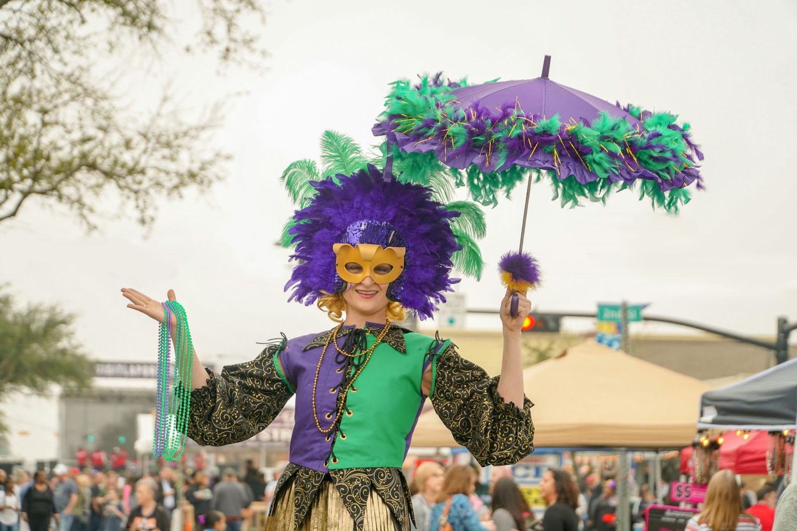 A woman dressed up for the Mardi Gras Extravaganza.