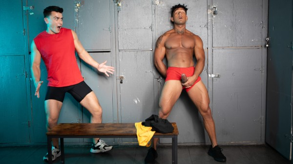gay shirtless male jerking off  in the gym locker room while getting caught masturbating by bisexual male in red tank top for men.com promo shot