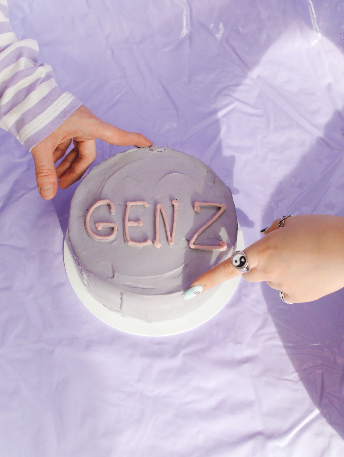 lavender cake with "Gen Z" written in icing
