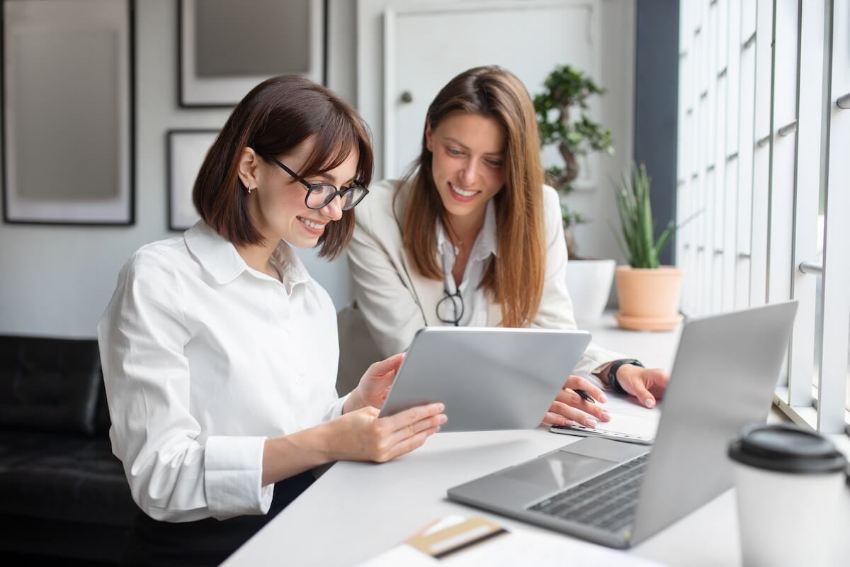 Colleagues watching something using a tablet