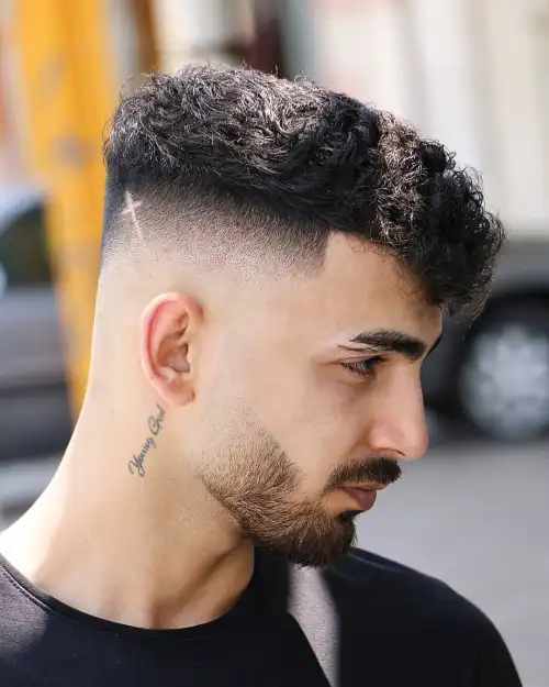 Picture showing a guy rocking the  hairstyle with a high fade 