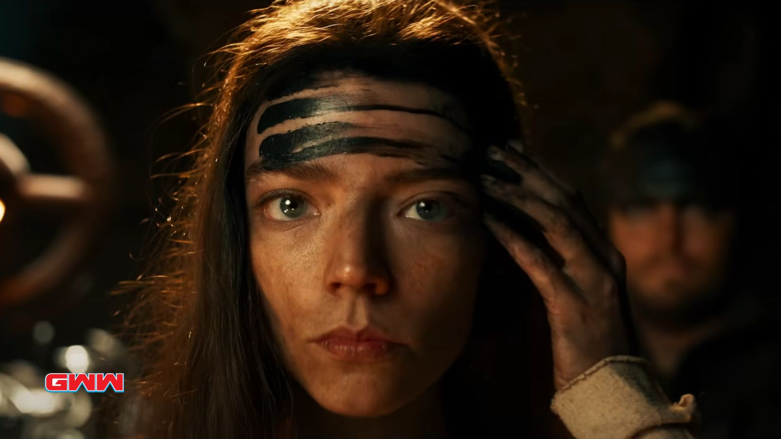 Close-up of Anya Taylor-Joy Furiosa with black streaks on forehead