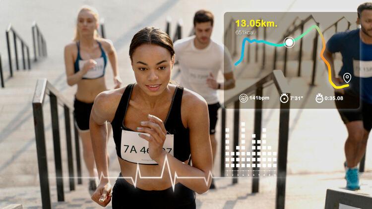 A person running with a number on her chest

Description automatically generated