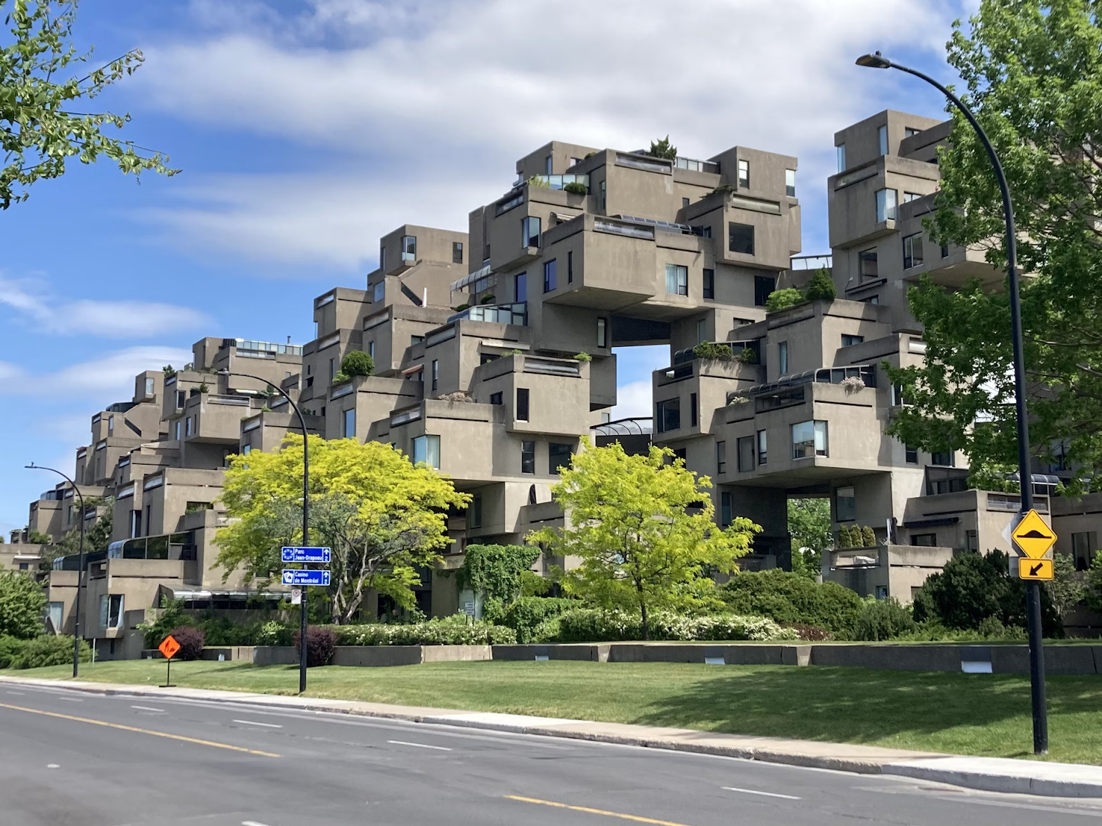 Street View Image of Habitat 67 Featuring a Row of Buildings With Unique Brutalist Design.