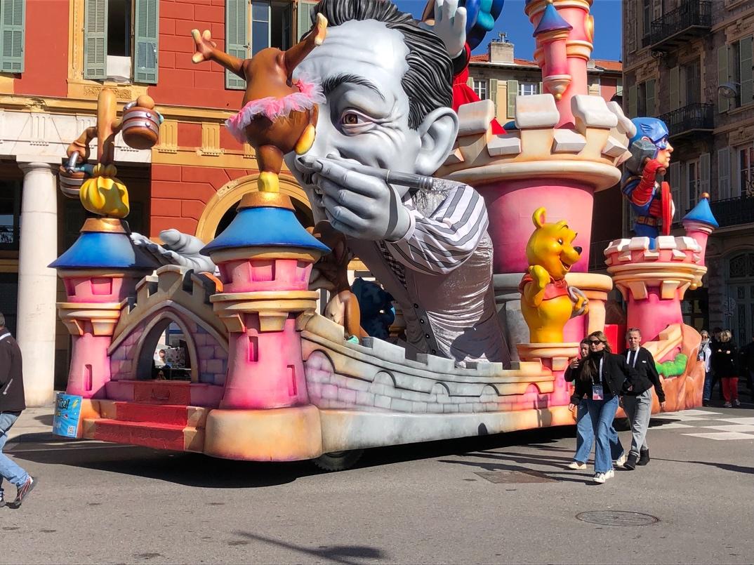 A float with a cartoon character on it

Description automatically generated