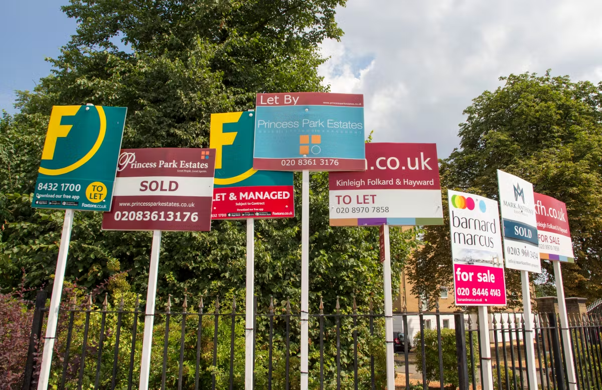 A confusing array of estate agent boards.