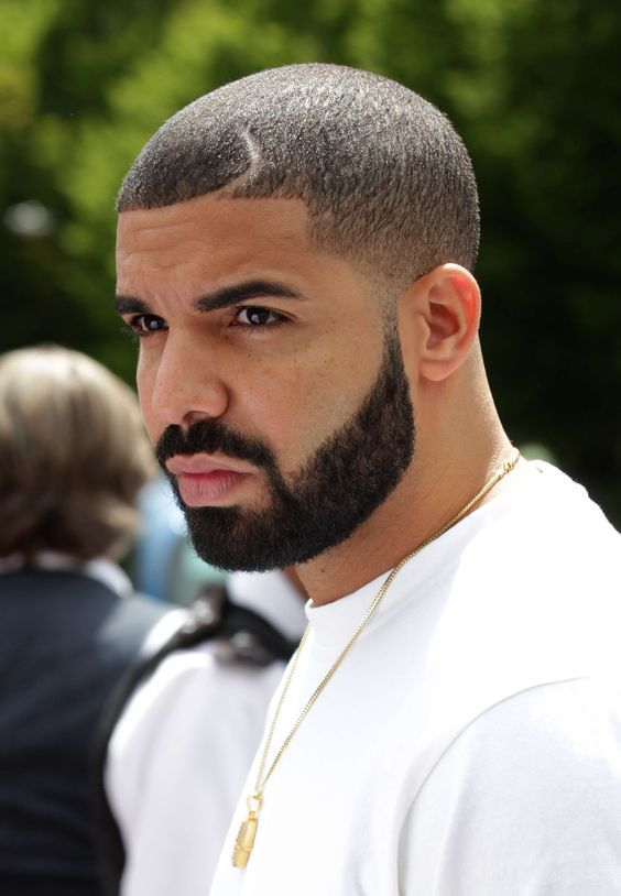 Picture showing  Drake with the iconic Buzz cut