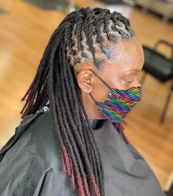 Picture showing a lady rocking the half up twisted dreads